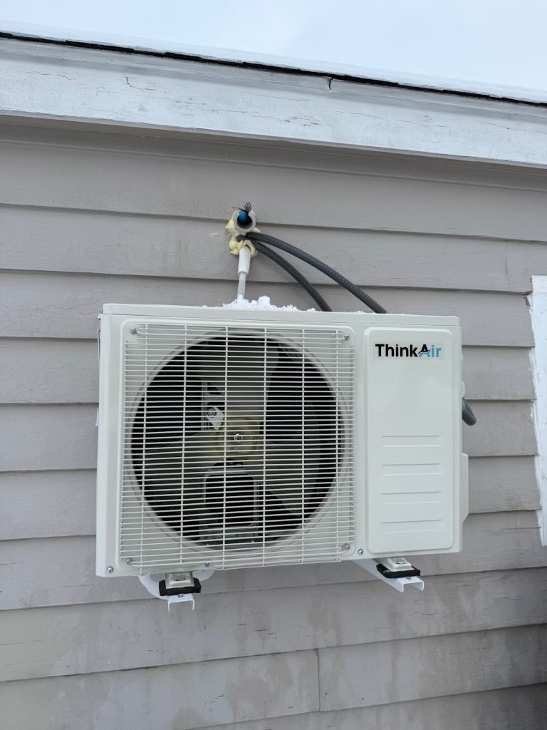 Ductless mini-split system installed on a home exterior