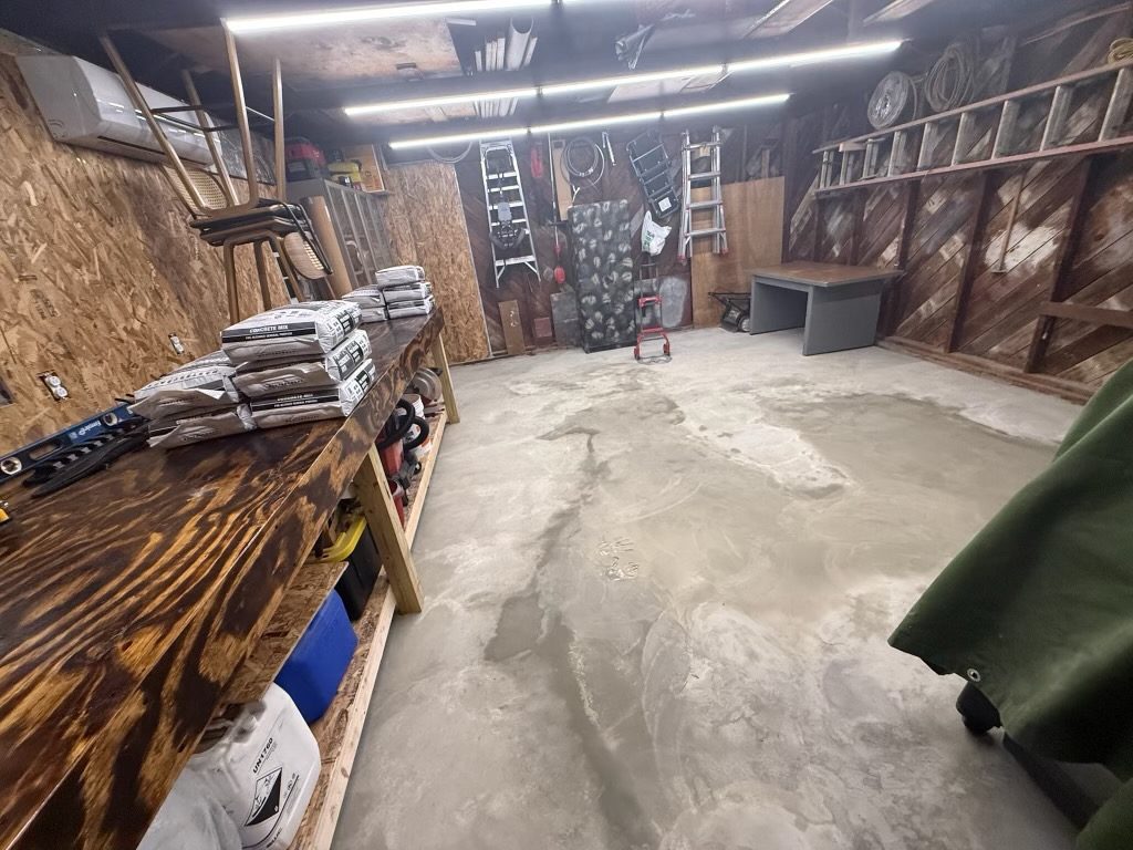 Renovated garage interior with a finished concrete floor
